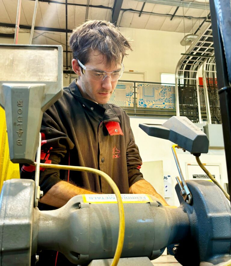 Operating a Cadillac Lathe.